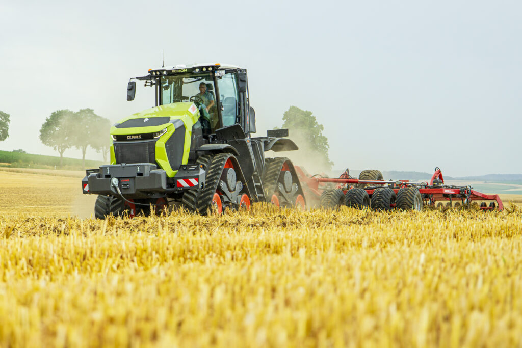 Claas Xerion tractor cultivating land